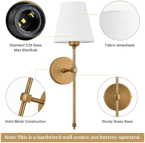 Brass wall sconce styled above a bathroom mirror