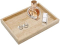 Natural travertine vanity tray styled with perfume bottle and jewelry