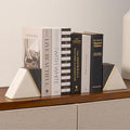 Marble bookends styled on a bookshelf