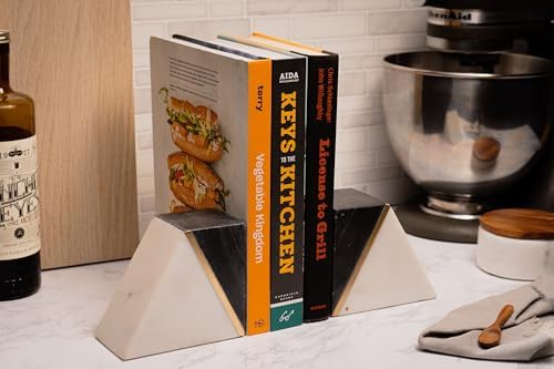 Marble bookends holding books on a desk