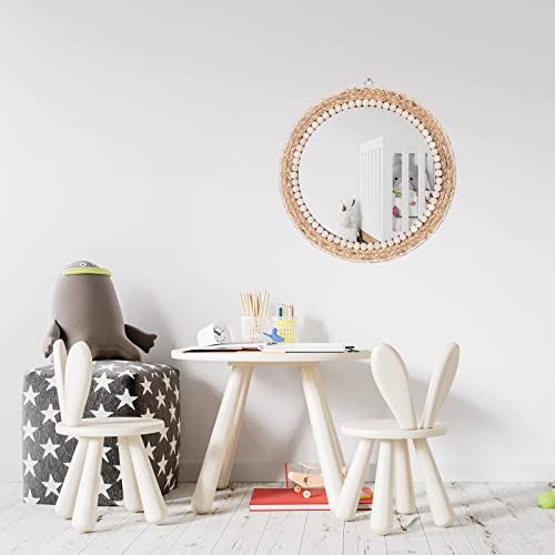Rattan wall mirror styled in an entryway