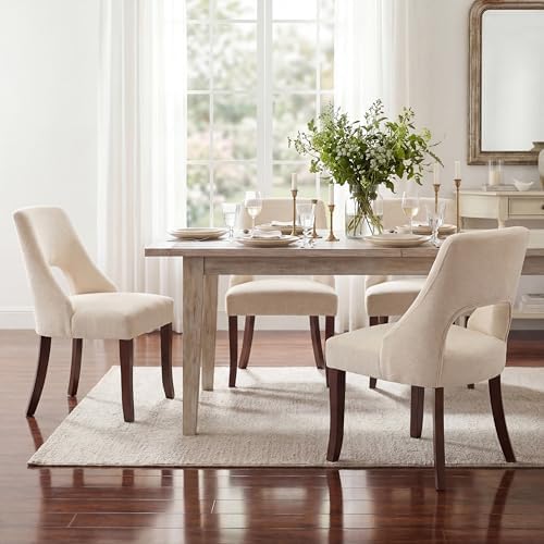 Close-up of wood legs on upholstered dining chair