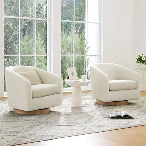 Cream barrel chair styled in a living room corner