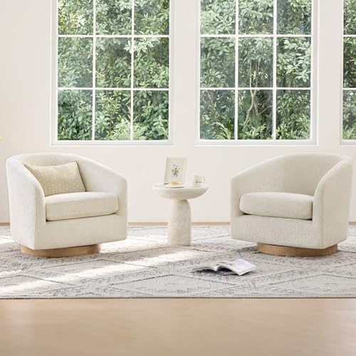 Close-up of solid wood swivel base on cream barrel chair