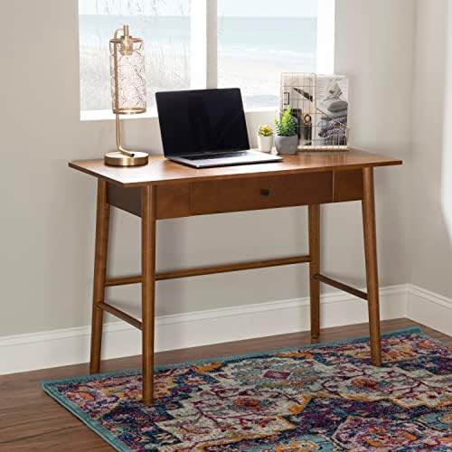 Walnut desk styled in a home office