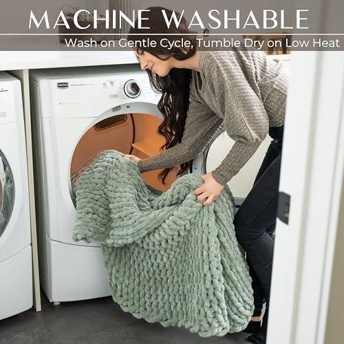 Chunky knit throw blanket draped over bed