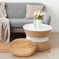 Jute pouf ottoman used as a footrest