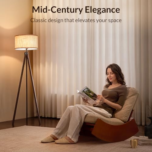 Walnut tripod floor lamp styled in living room corner