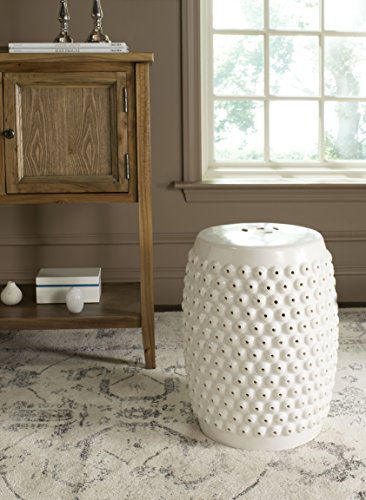 Ceramic garden stool styled beside a chair