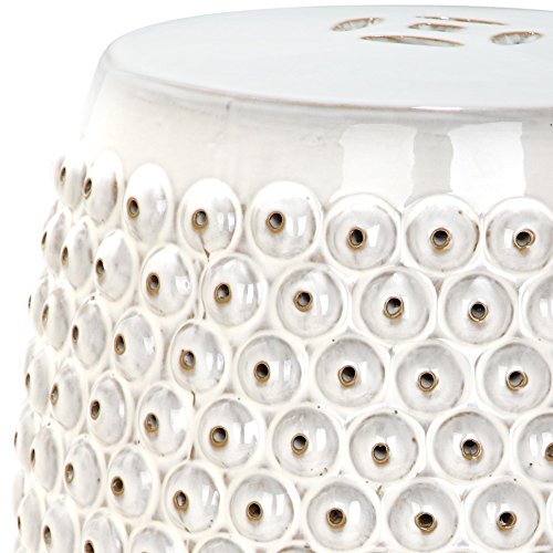 Close-up of nailhead texture on ceramic garden stool