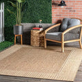 Bordered indoor outdoor area rug styled on a patio