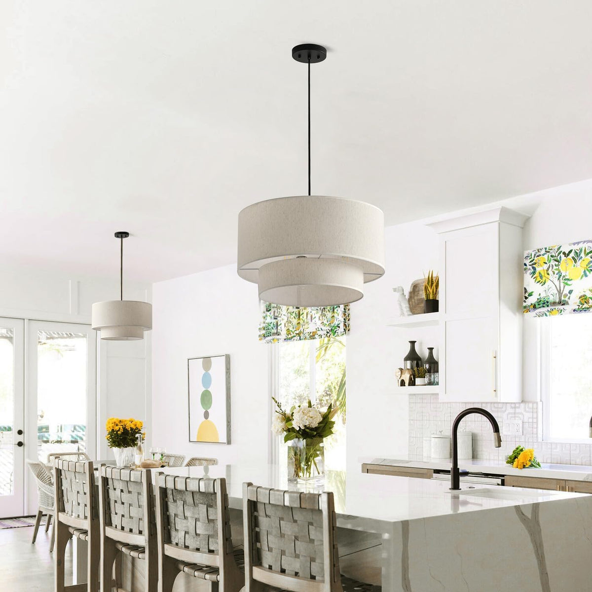 Linen drum pendants hanging over a kitchen island