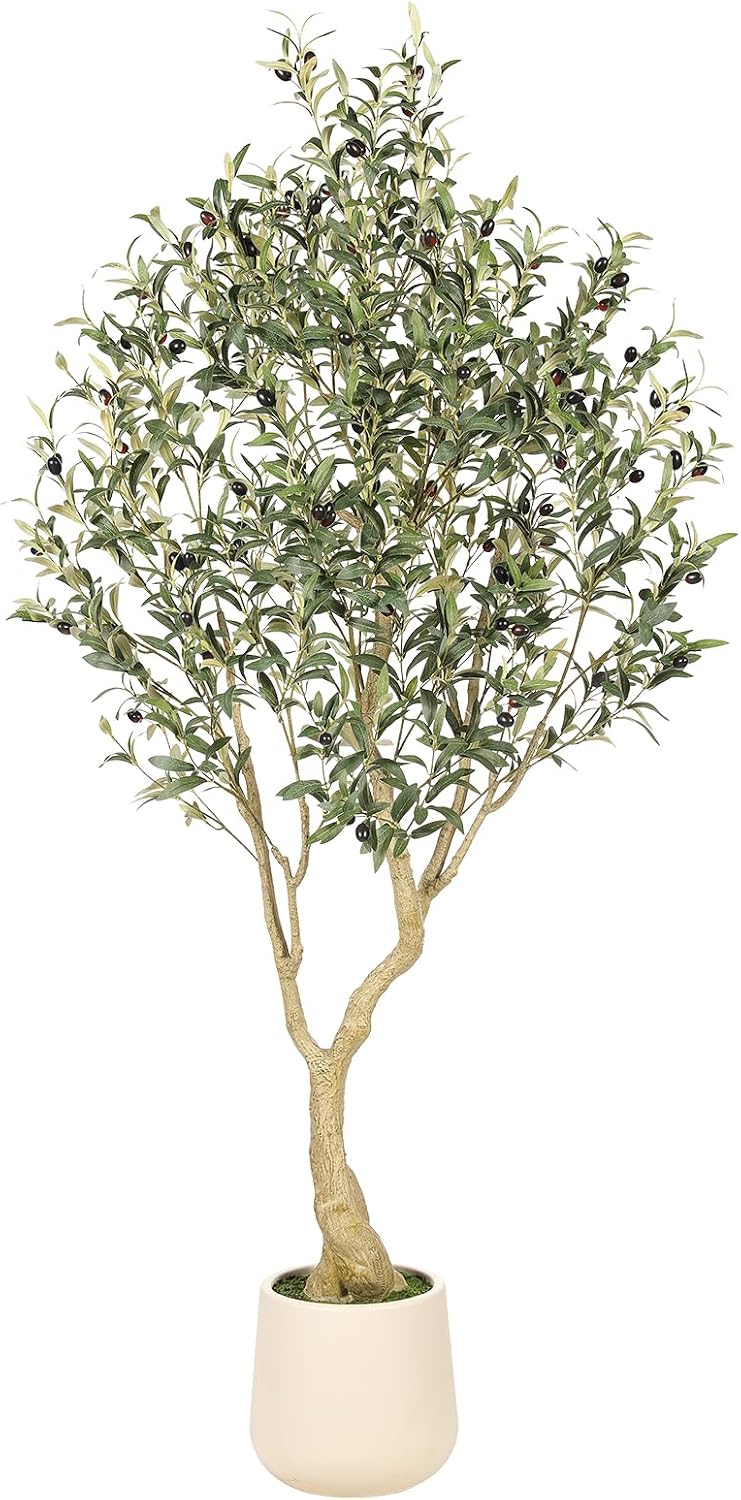 Faux olive tree in a tall white ceramic planter