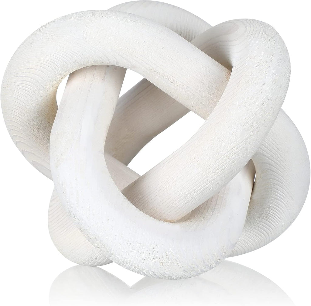 Modern wood knot sculpture on a plain background
