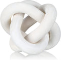 Modern wood knot sculpture on a plain background