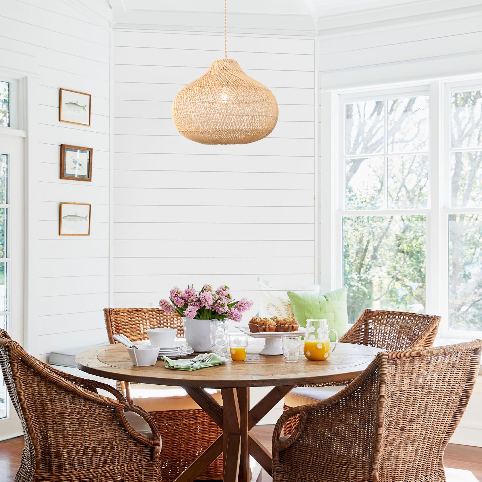 Rattan pendant light illuminated, showing the warm ambient glow
