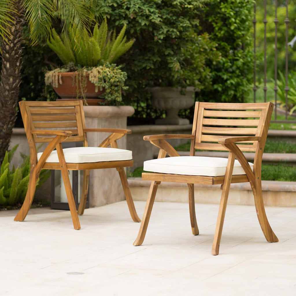 Acacia patio arm chair shown on a plain background