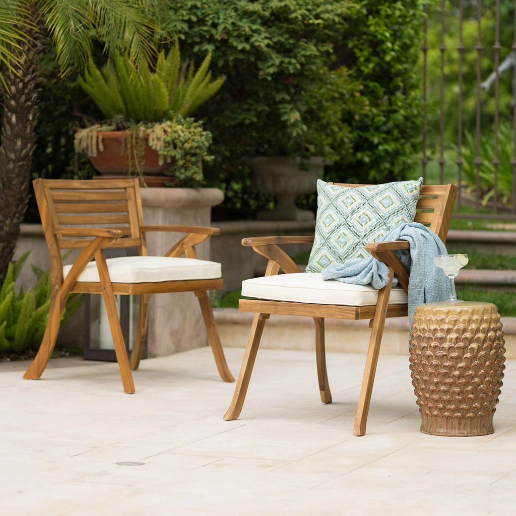 Hermosa acacia patio arm chairs styled on an outdoor patio
