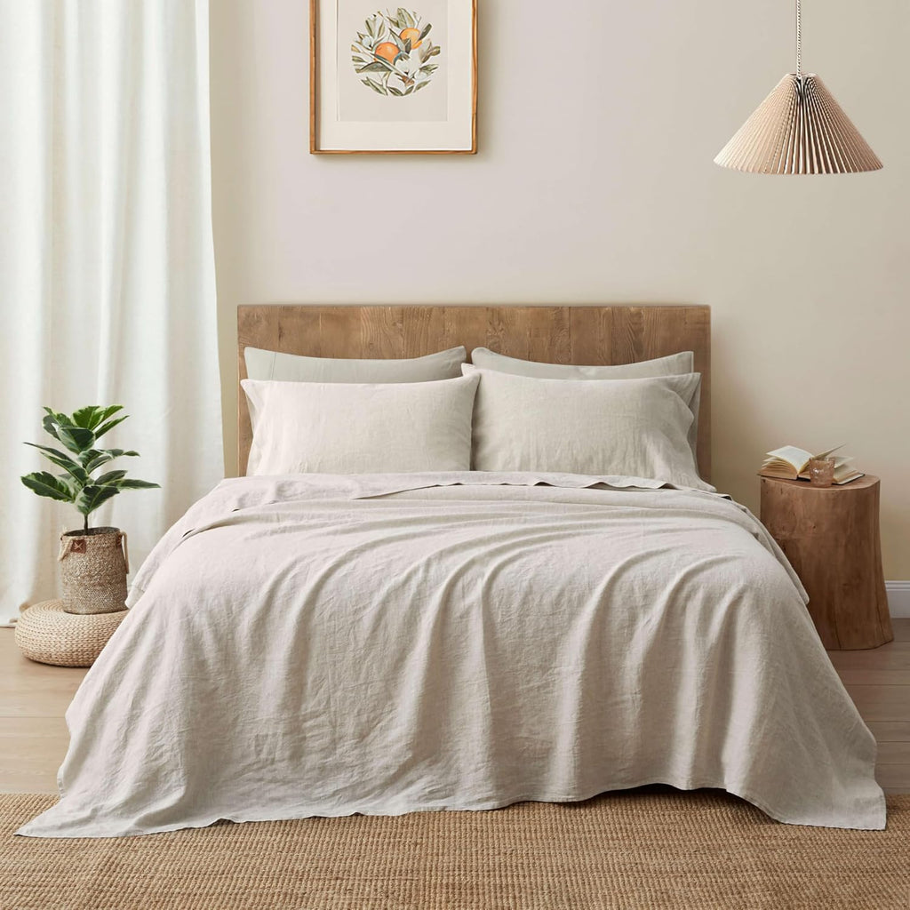Natural French flax linen sheet set on a bed with a woven headboard